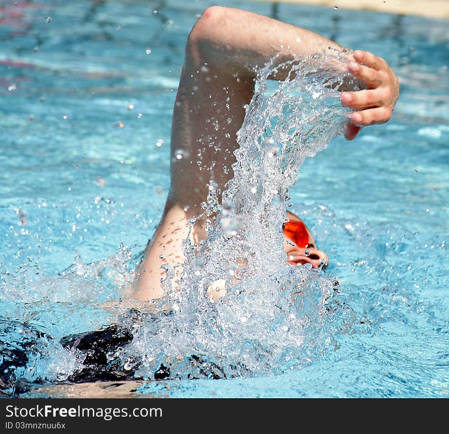 Professional Freestyle Swimmer in the outdoor pool. Professional Freestyle Swimmer in the outdoor pool