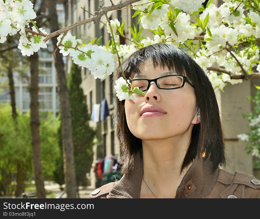 Girl smelling the flowers