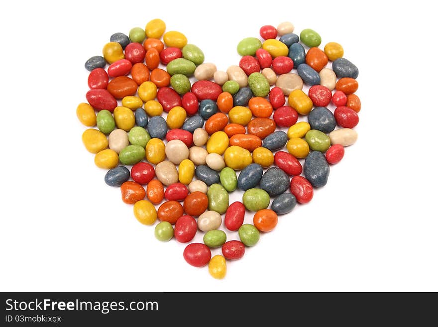 Colorful tasty candy in the shape of heart - isolated on white background. Colorful tasty candy in the shape of heart - isolated on white background