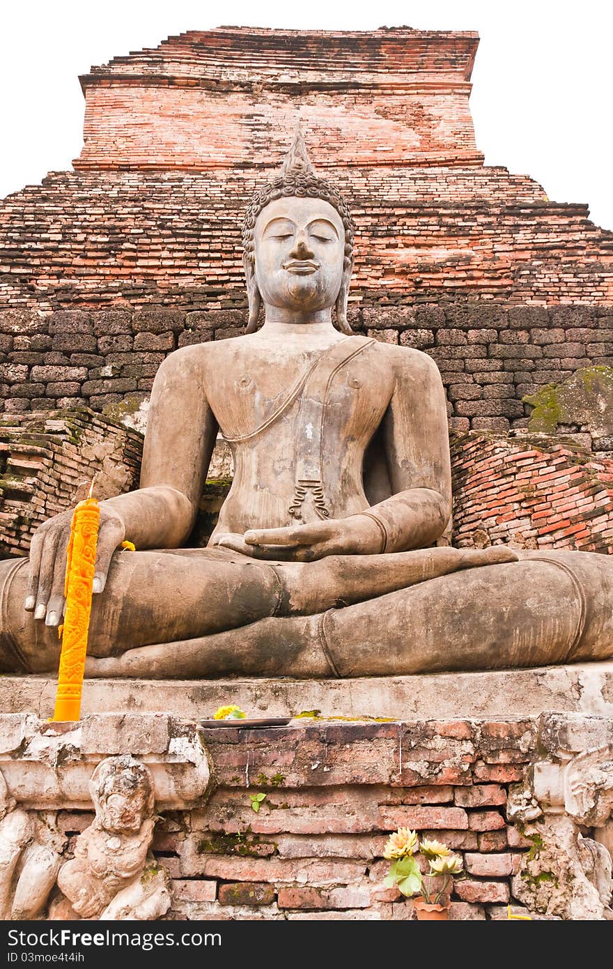 Buddha statue in front of pagoda vertical