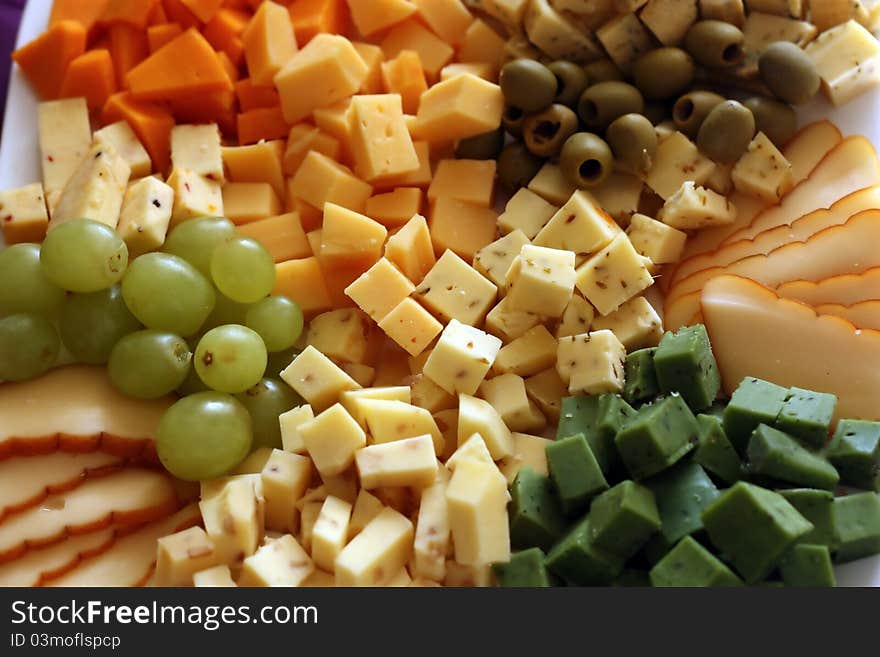 Bowl of various diced cheese