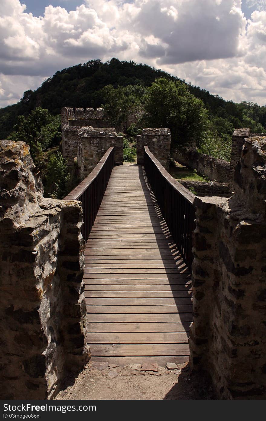 Old castle wooden bridge, forrest on the background. Old castle wooden bridge, forrest on the background