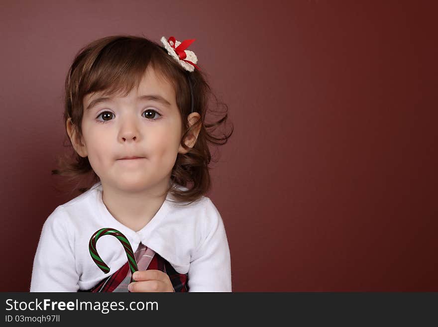 Cute brunette girl against a brown red background