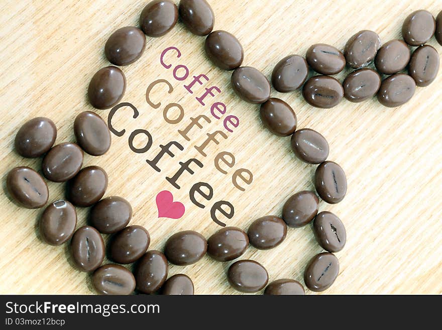 Cup of coffee on wood background.