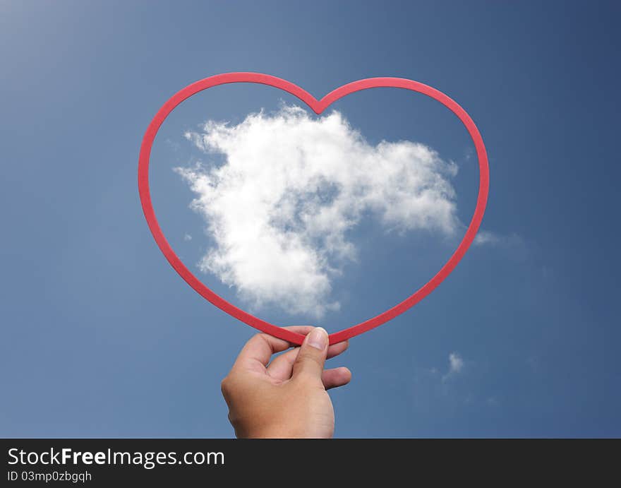 Hands taking a heart with the cloud inside. Hands taking a heart with the cloud inside