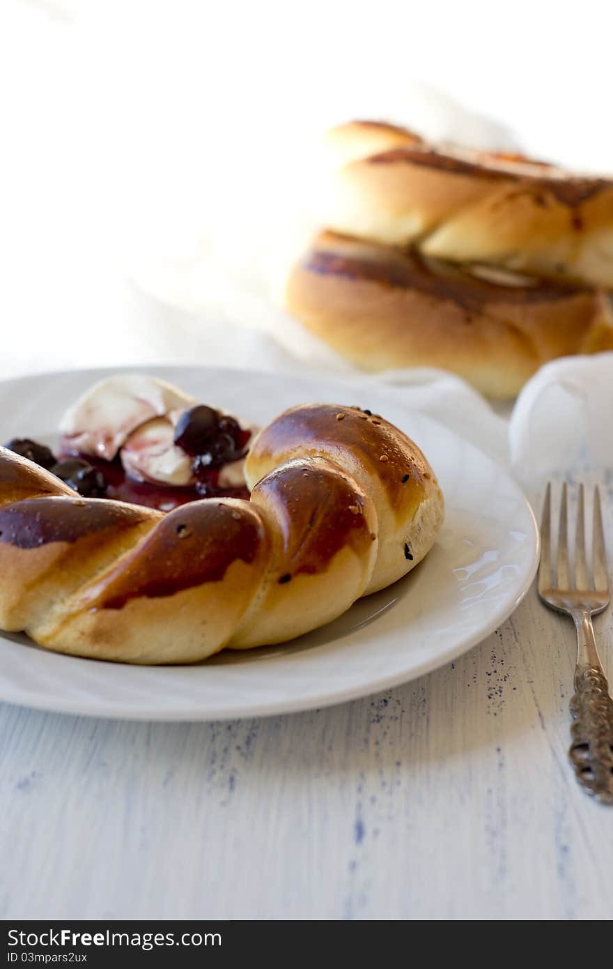 Composition with buns, jam and cream cheese