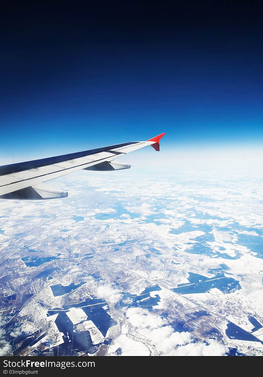 Wing aircraft in flight above the ground. Wing aircraft in flight above the ground