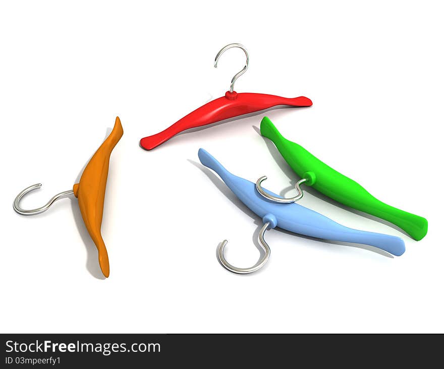 Set of colorful hangers on white surface