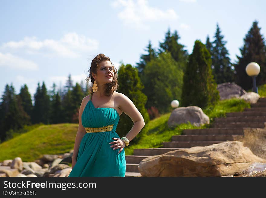 Beautiful girl in the blue walks. Beautiful girl in the blue walks