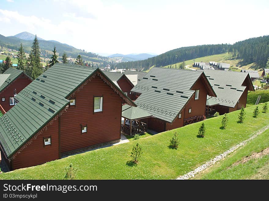 Brown Wooden Houses In The Mountains