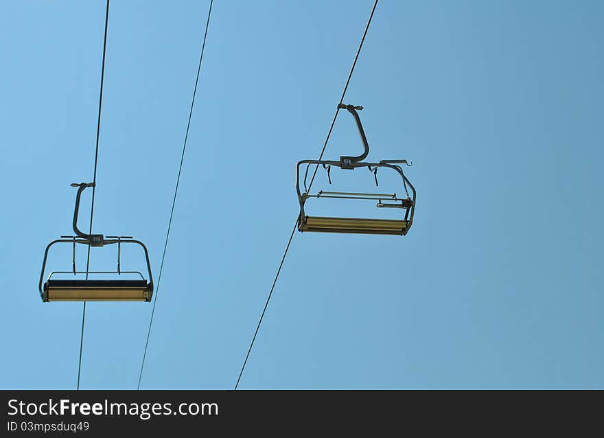 Chair lift and blue sky, shooted at Carpathians