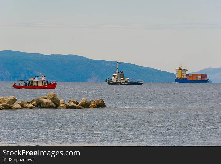 Three colorful ships near harbour of RIjeka during cloudy day. Three colorful ships near harbour of RIjeka during cloudy day