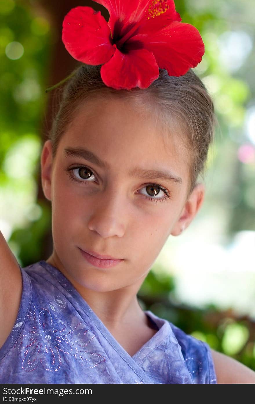 Portrait of a girl wearing flower in her hair