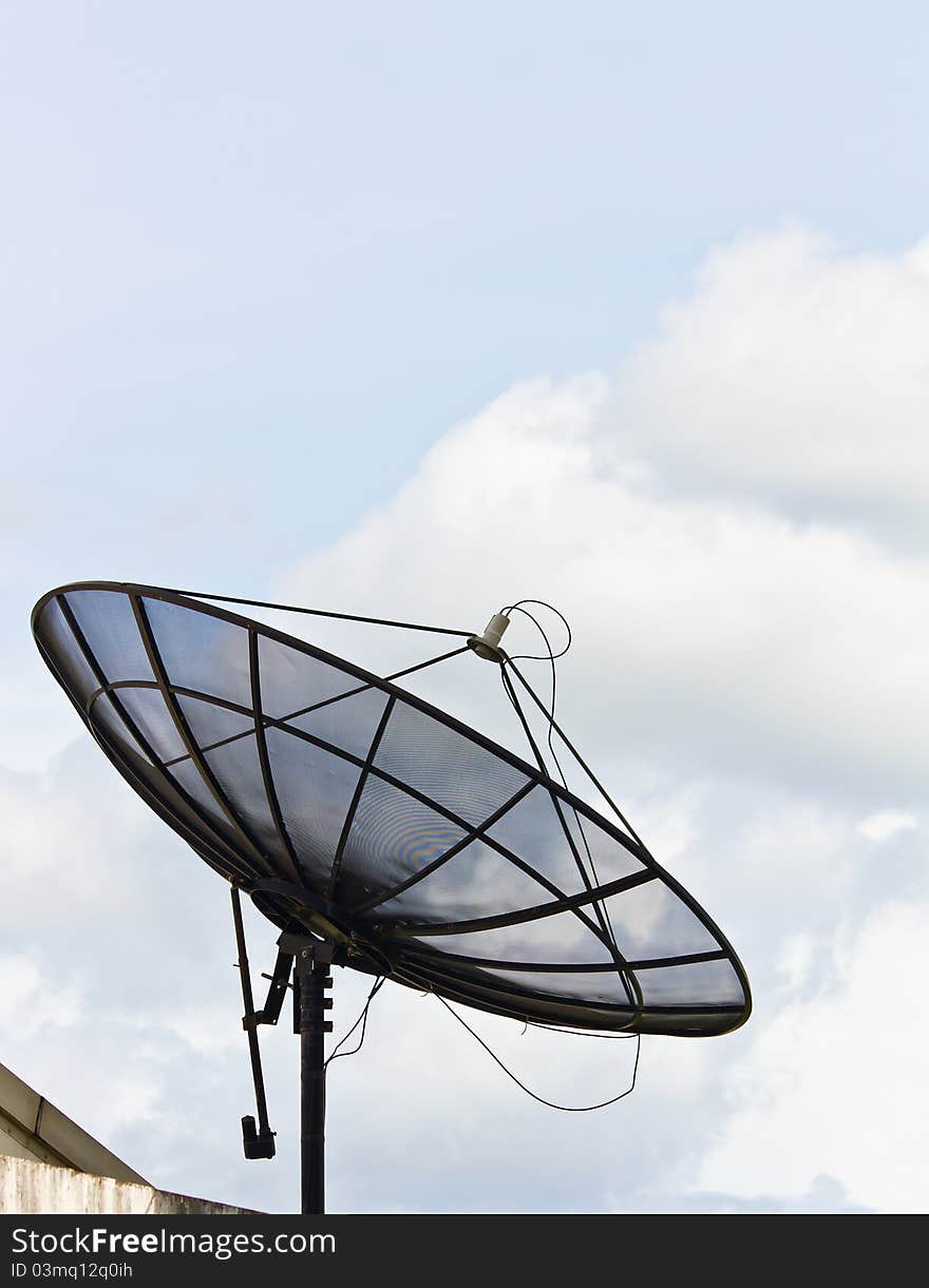 Old black satellite dish on the roof