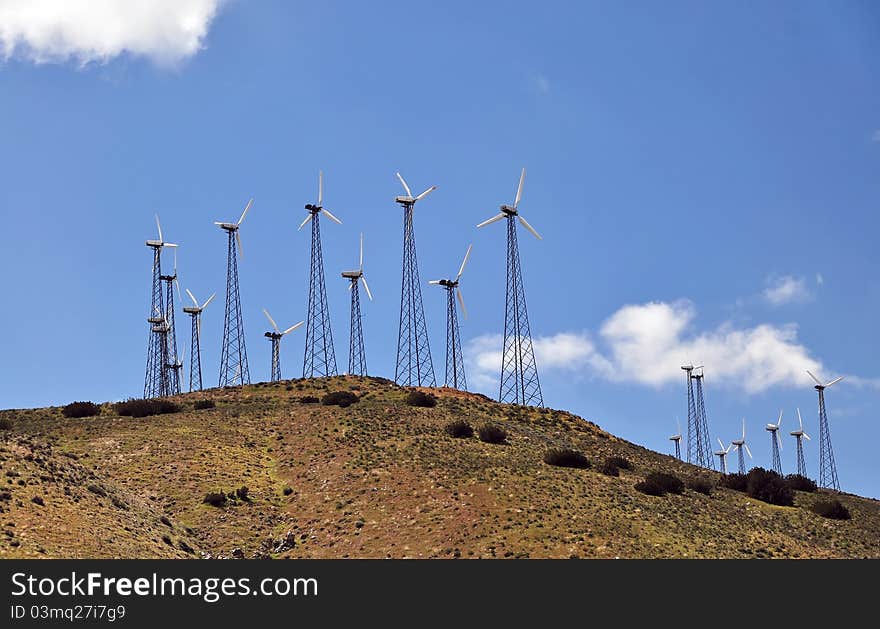 Windmill farm: Power Generating Windmills on hill. Alternative energy source. California, USA