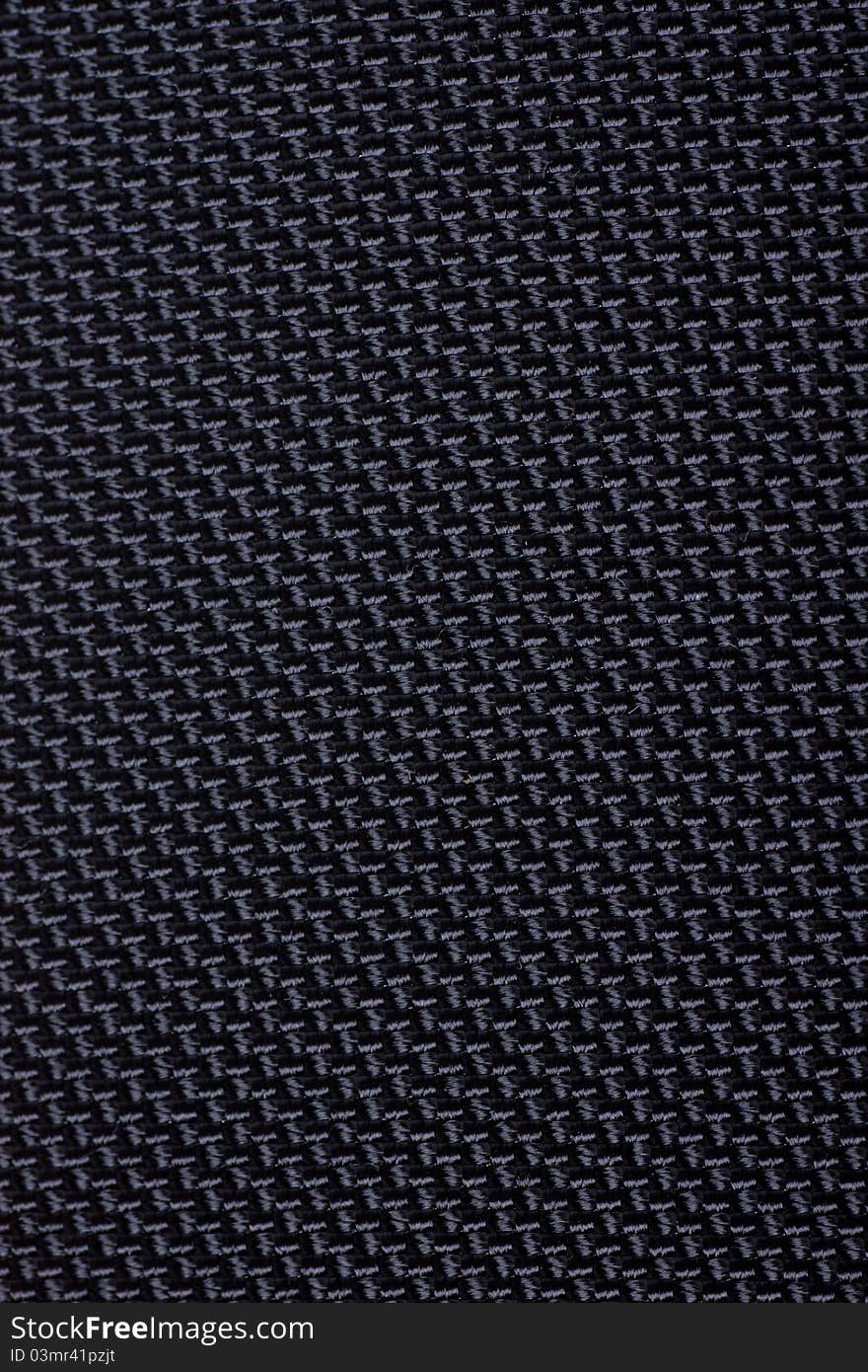 Black textile fabric pattern. Macro view.