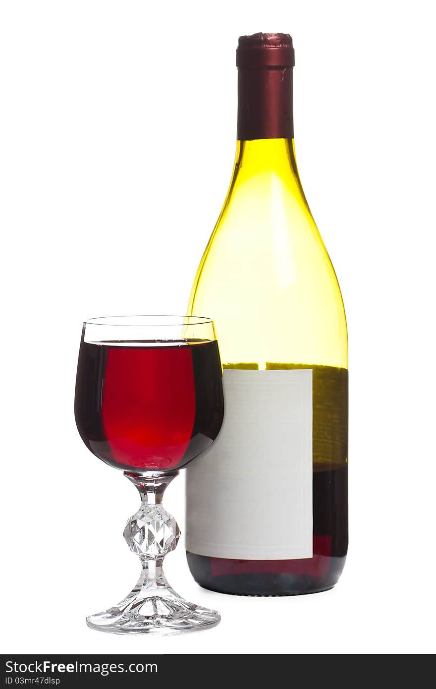 Wine glass and bottle with wine isolated over white background