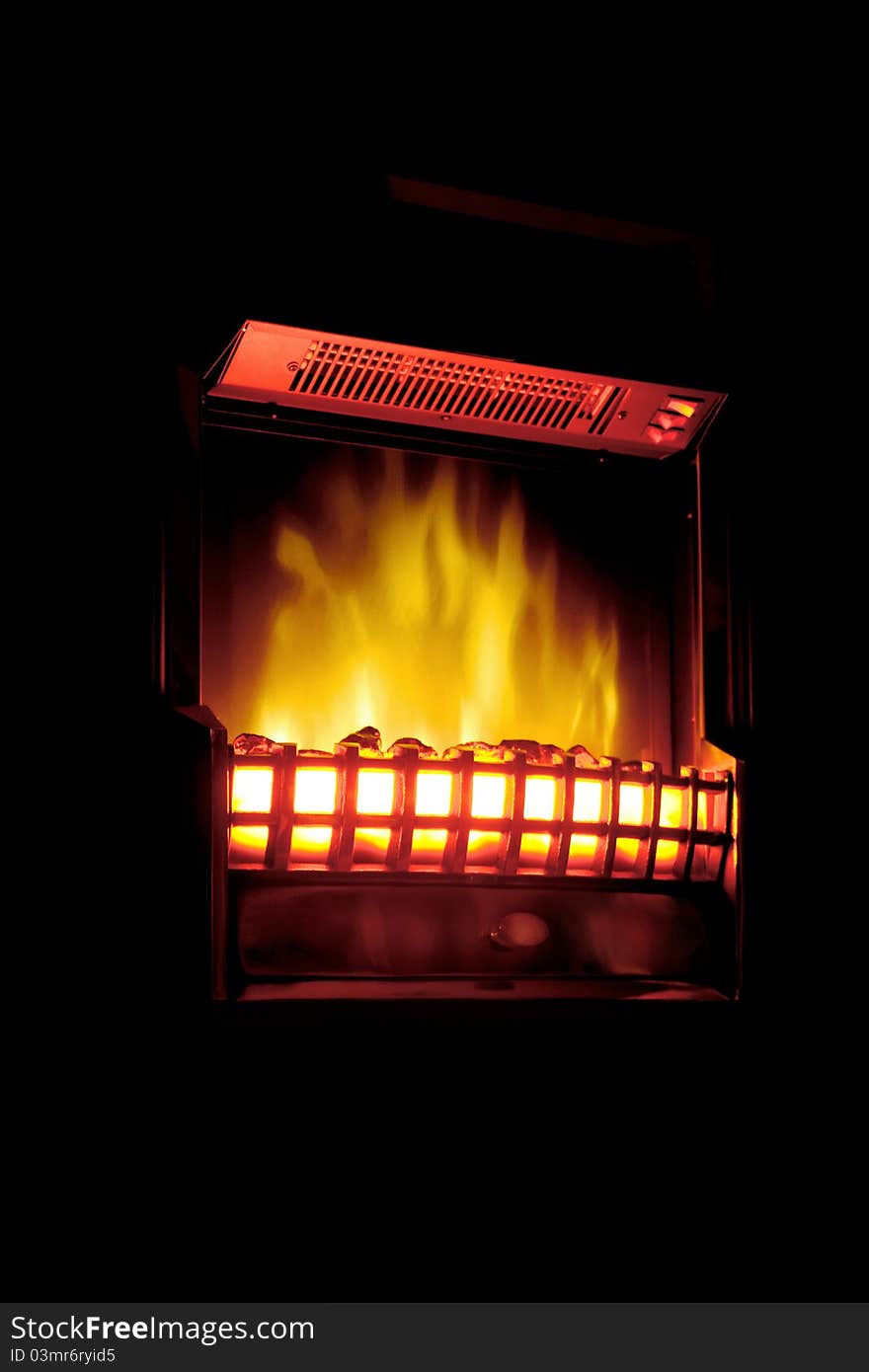 Heater with a flame effect, located on a black background. Heater with a flame effect, located on a black background.