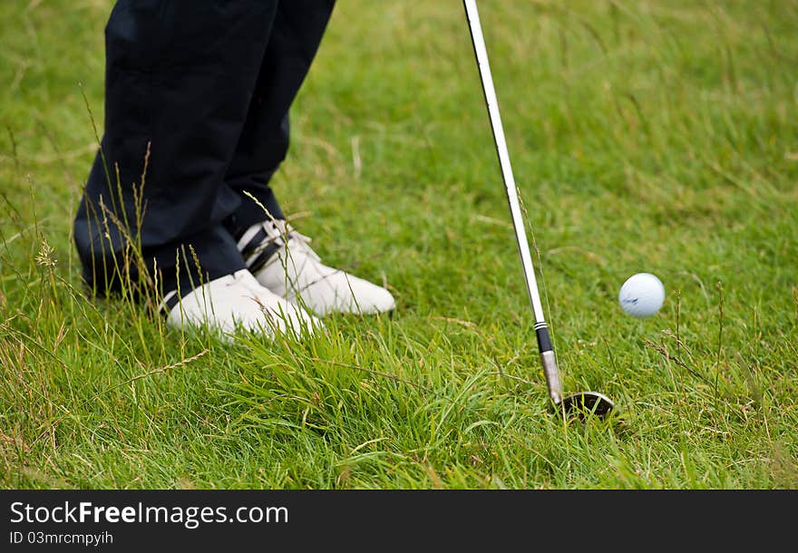 Golf chip shot from the rough in colour