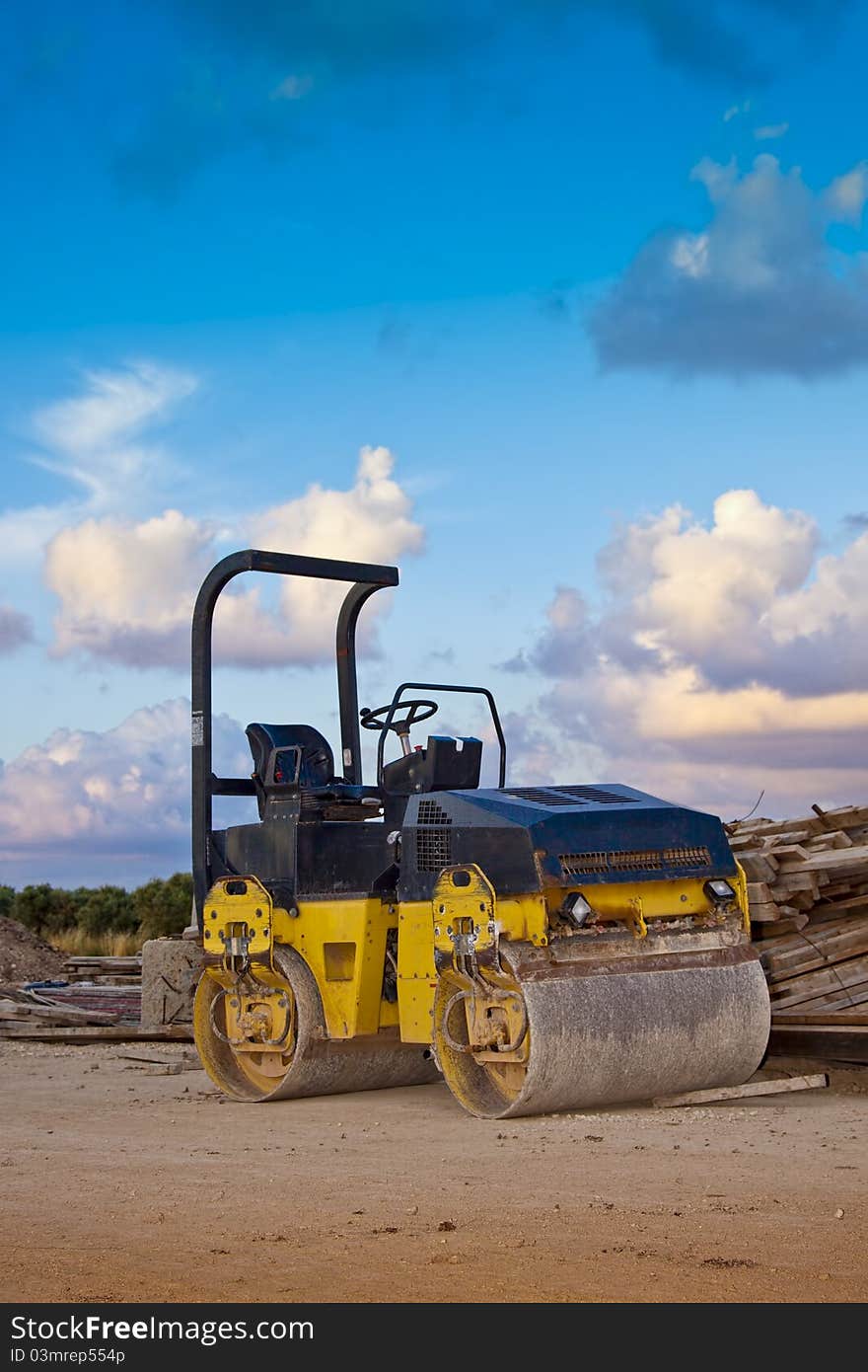 Rolling asphalt on a field with beautiful blue sky