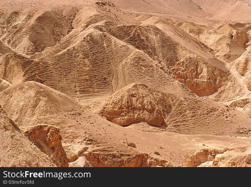 Textured orange hills in the desert. Textured orange hills in the desert