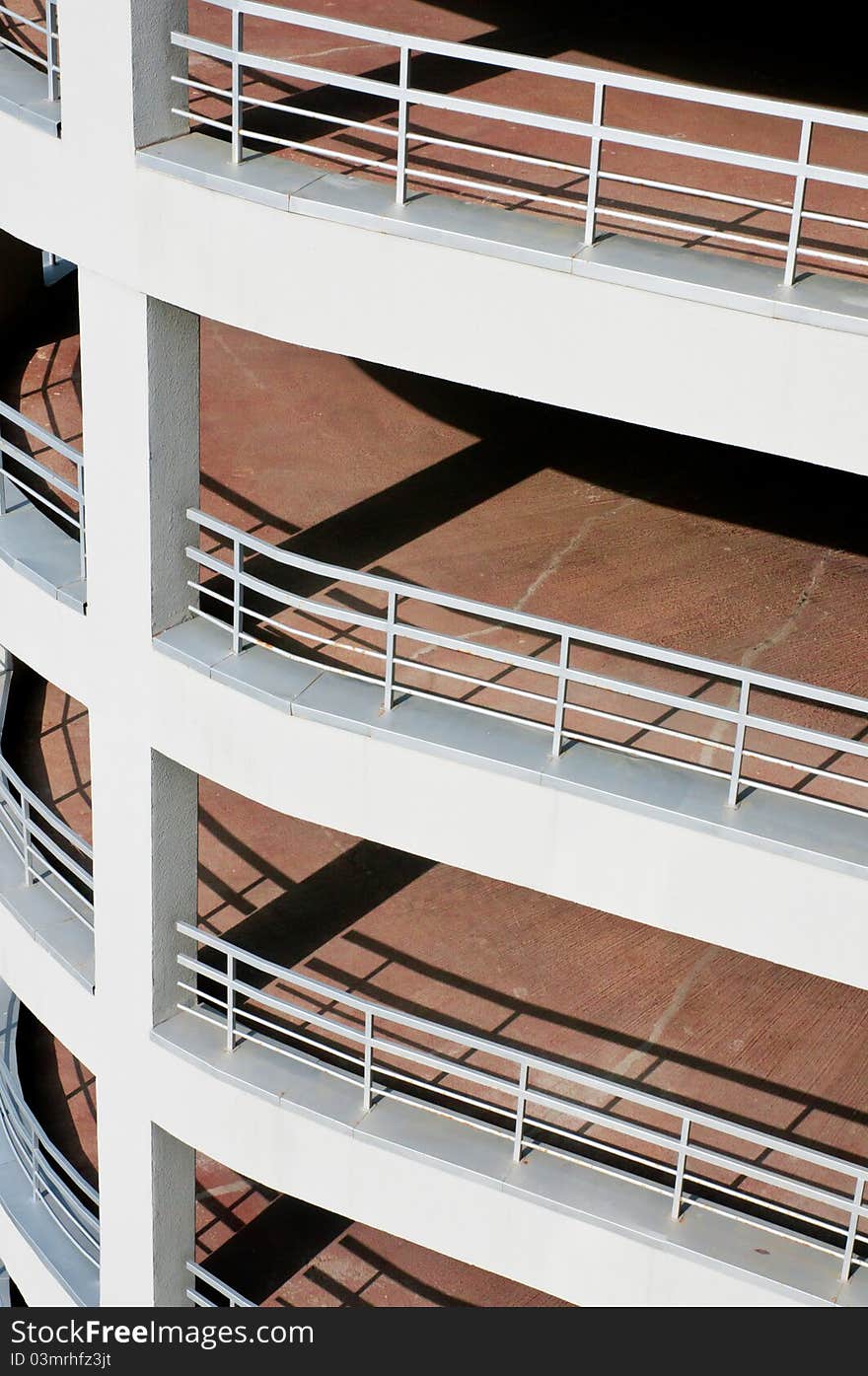 White empty pier to the parking lot, an abstraction. White empty pier to the parking lot, an abstraction