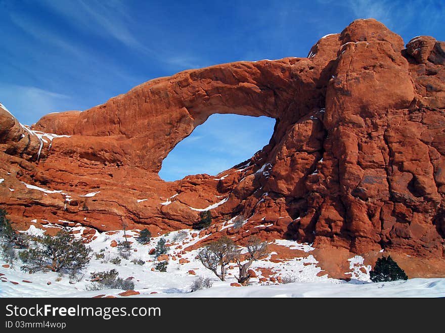 Arches National Park, Utah - December 09, 2009 - Unique winter image of the South Window Arch with snow in Arches National Park. Located near Moab, Utah. Arches National Park, Utah - December 09, 2009 - Unique winter image of the South Window Arch with snow in Arches National Park. Located near Moab, Utah.