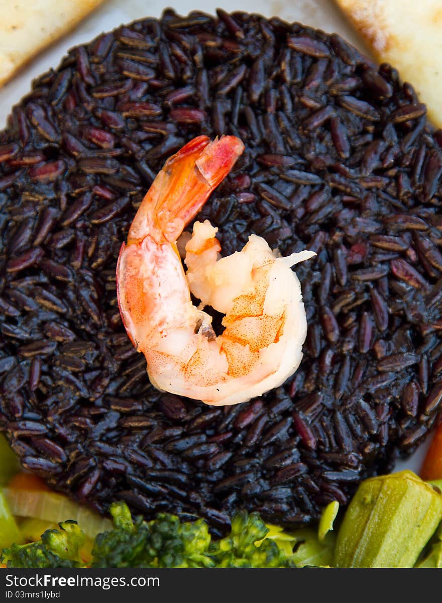 Fish with black rice, vegetables and prawn. Fish with black rice, vegetables and prawn