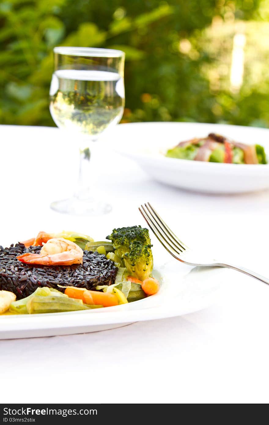 Fish with black rice, vegetables and prawn. Fish with black rice, vegetables and prawn