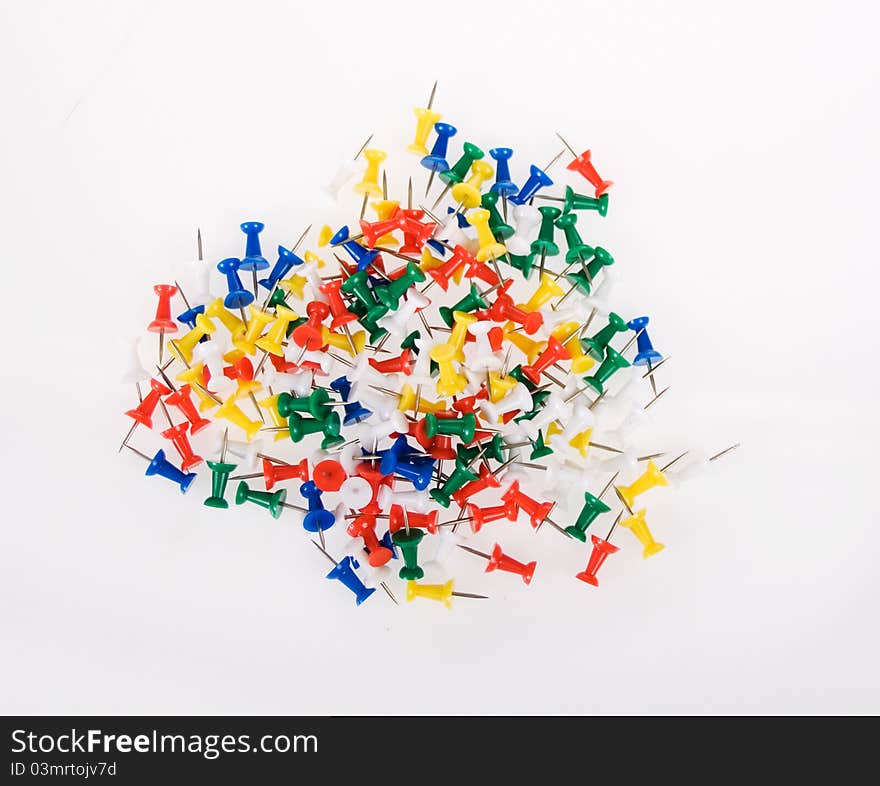 Multi Colored Push Pins on a White Background