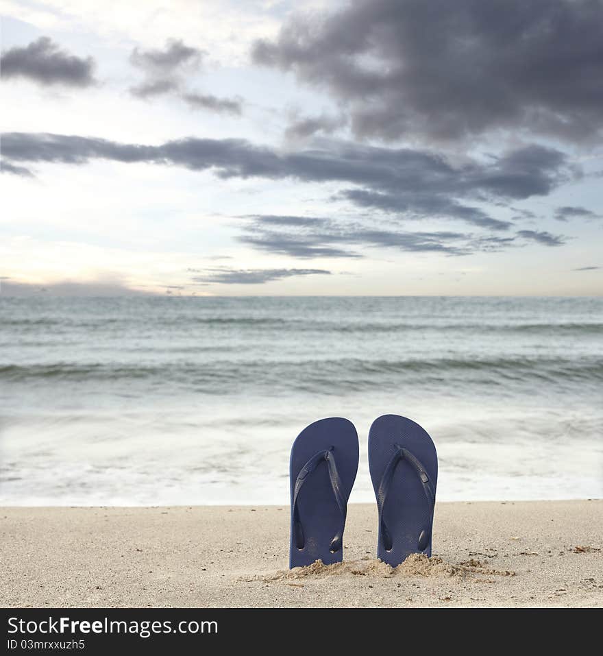 Standing sandals on beach