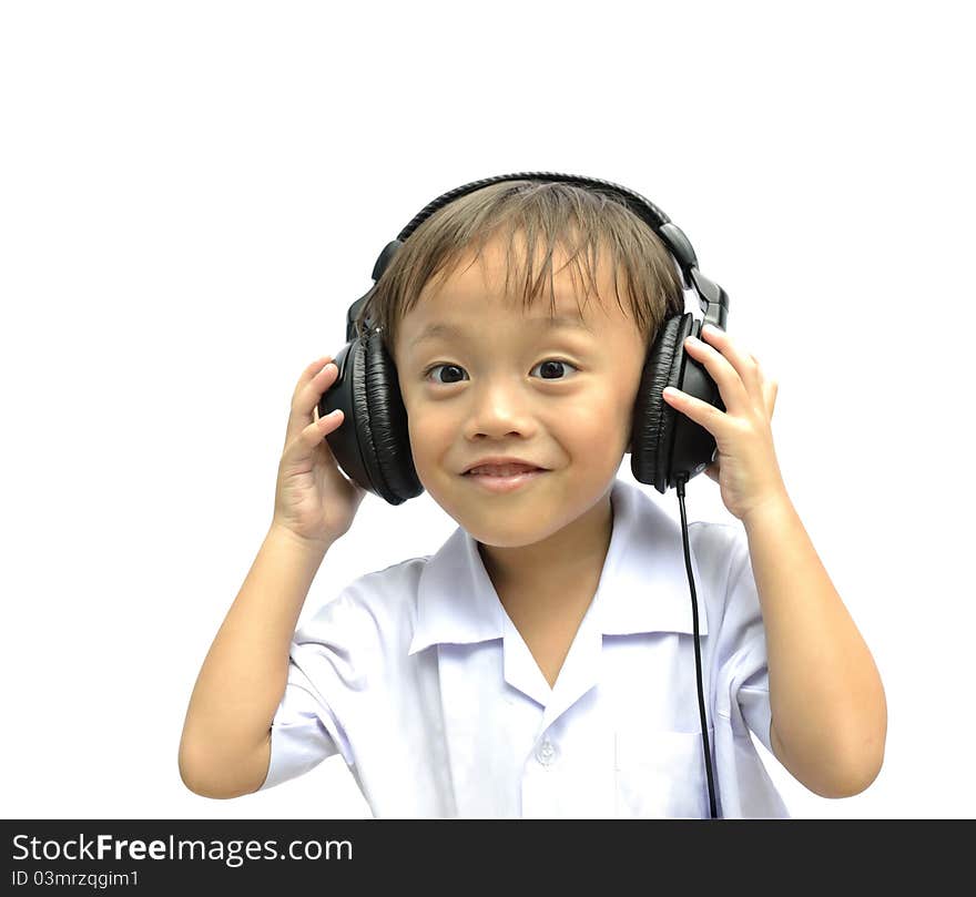 Cute asian young boy using headphone on white background. Cute asian young boy using headphone on white background.