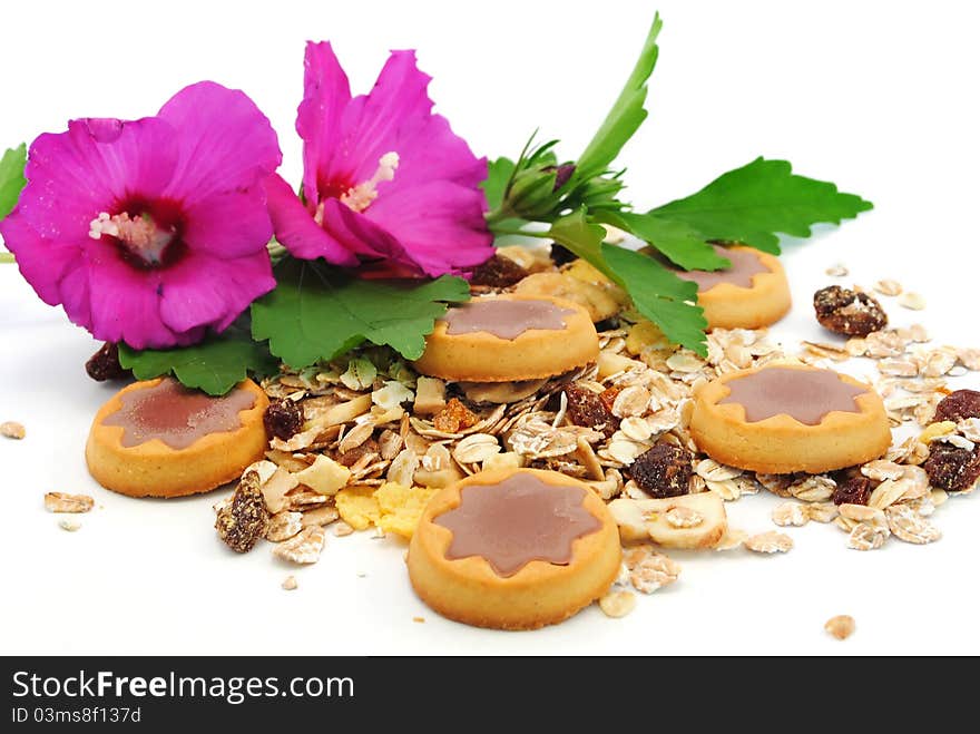 Cookies with chocolate and muesli on white background. Cookies with chocolate and muesli on white background.