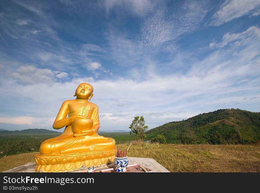 Image buddha statue on mountain with blue sky