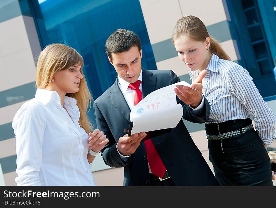 Business people meeting in a modern downtown.