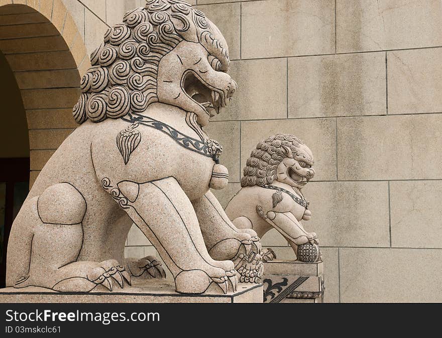 Lion statue in fron of Chinese temple