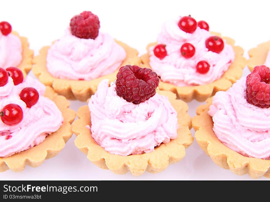 Tartlets with whipped cream and fruits - raspberries and redcurrants