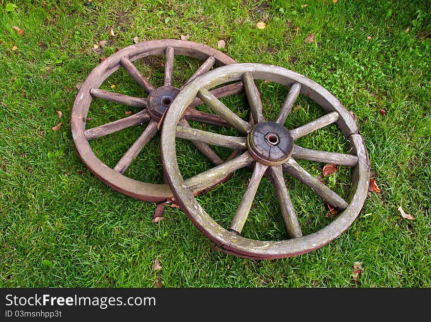 Two old broken wheel from vintage cart. Two old broken wheel from vintage cart