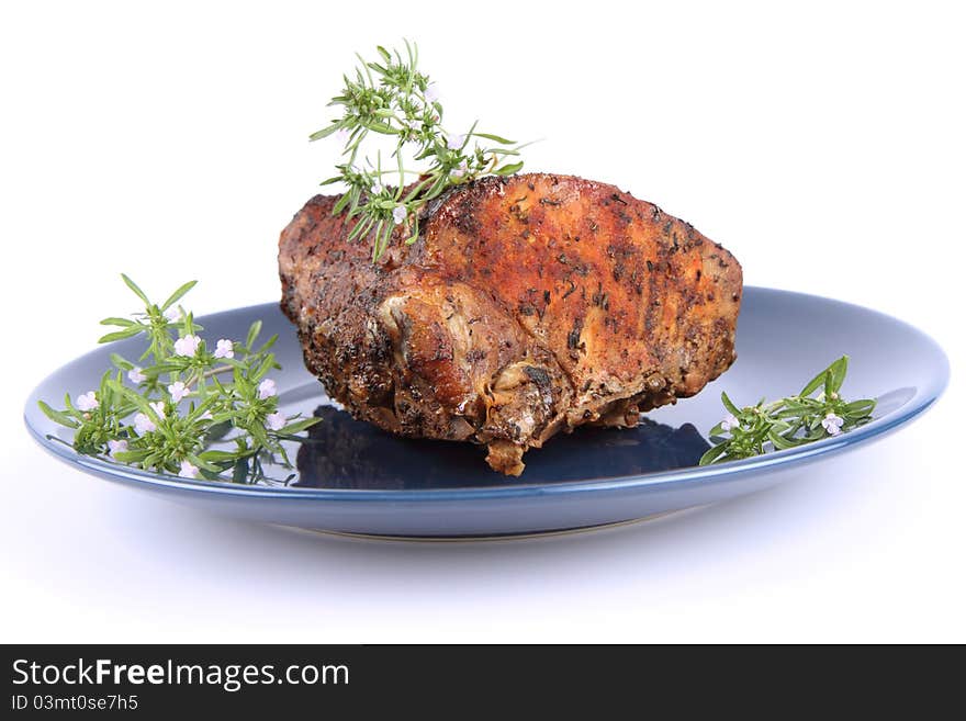 Roast pork decorated with savory blooming twigs