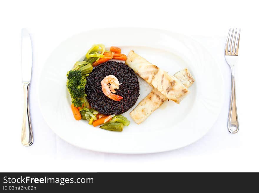 Fish with black rice, vegetables and prawn. Fish with black rice, vegetables and prawn