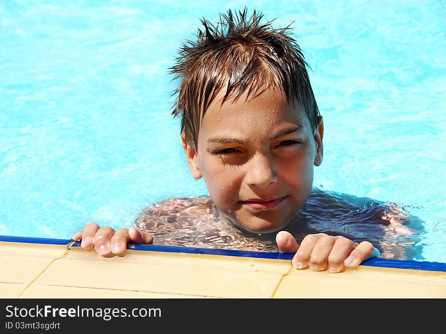 Young Smiling Boy In Pool