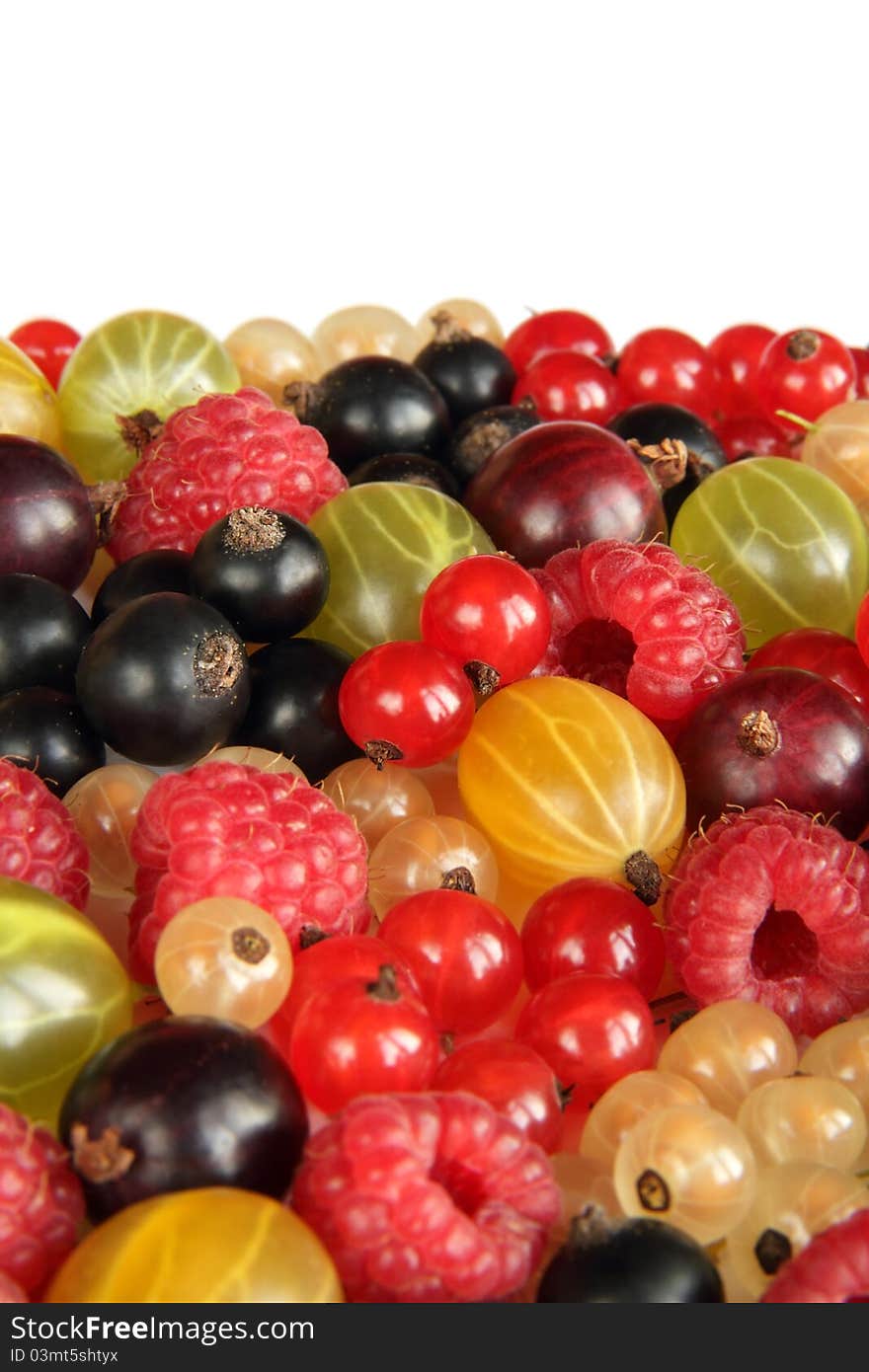 Berry background made of gooseberry, raspberry, black, red and white currants. Berry background made of gooseberry, raspberry, black, red and white currants