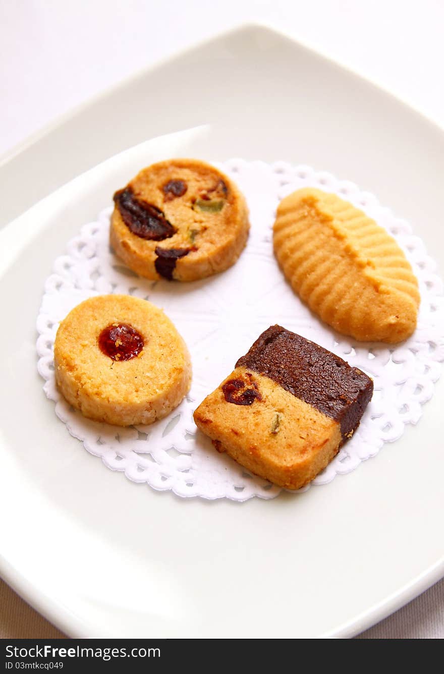 Various cookies on white dish