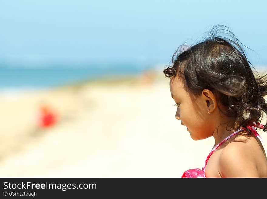 Cute asian little girl on the beach