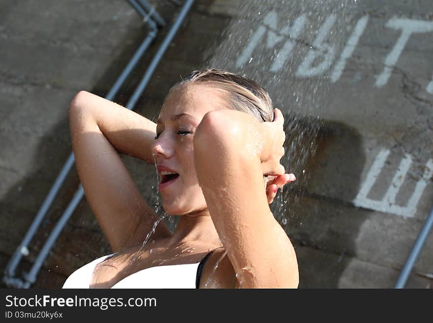 Portrait of beautiful young girl under water