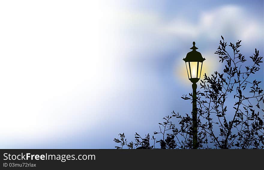 Glowing lantern near the branches of spring tree