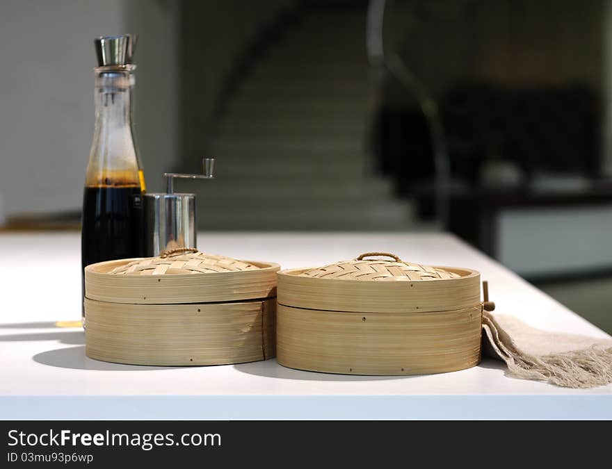 Bottle of balsamic vinegar and wooden boxes