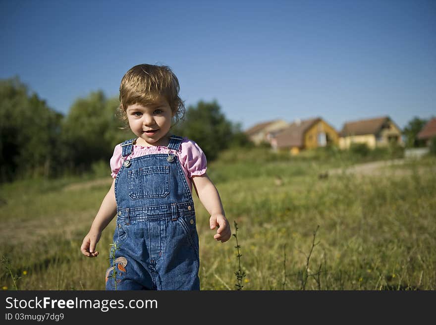 Portrait of smiling little girl with blue eyes, running. Portrait of smiling little girl with blue eyes, running