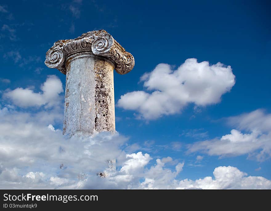 Column of the Roman city Abritus, romantic background sky with clouds. Column of the Roman city Abritus, romantic background sky with clouds