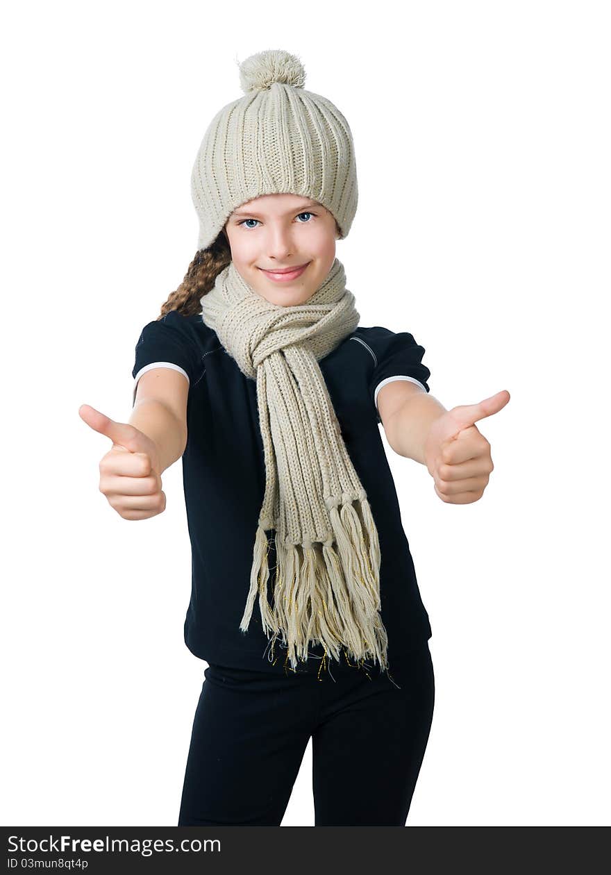 Beautiful little girl in cap and scarf isolated on white